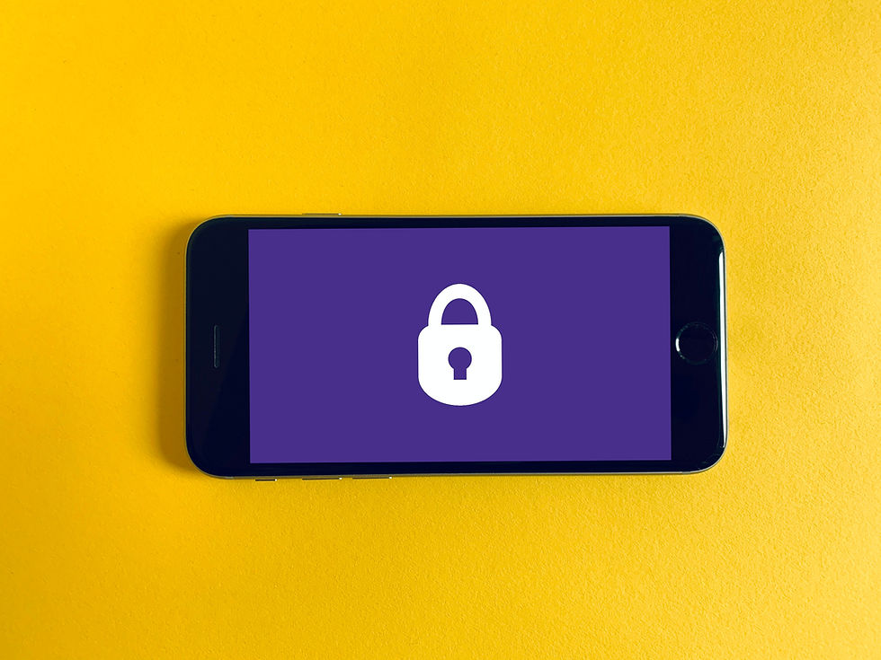 Smartphone on a yellow background displays a white padlock icon on a purple screen, symbolizing security or privacy.