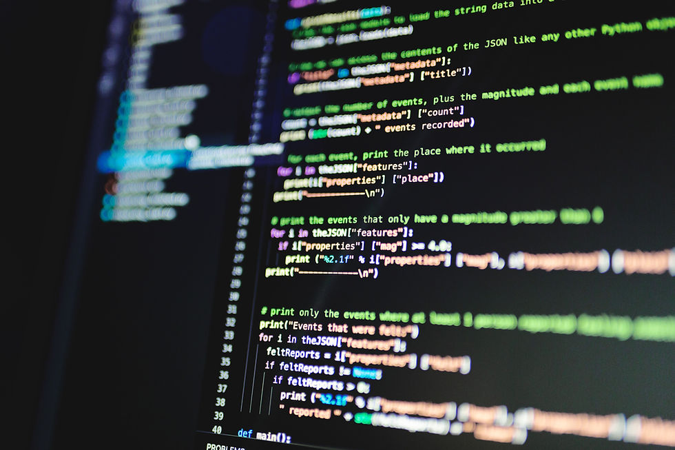 Close-up of a monitor showing colorful Python code on a dark screen, with blurred lines and a focused, technical mood.