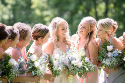 Bridesmaids holding wedding bouquets - Wedding reception photography company in Dubai and Abu Dhabi