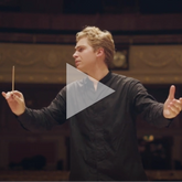 HK conducts Resonate Symphony.png