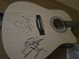 Annual Signed Guitar Auction Raises $2,000 for Veterans Charities at NWKS Radio Concert