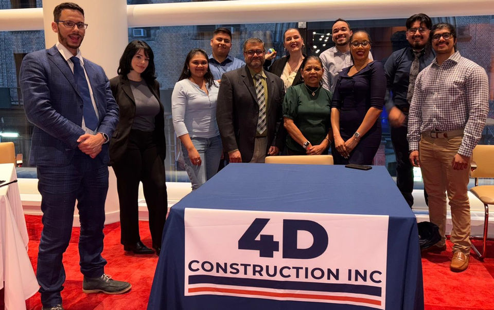 4D Construction Inc team members posing together at an event.