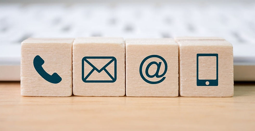 Wooden blocks with phone, email, at, and phone icons; Contact Us.