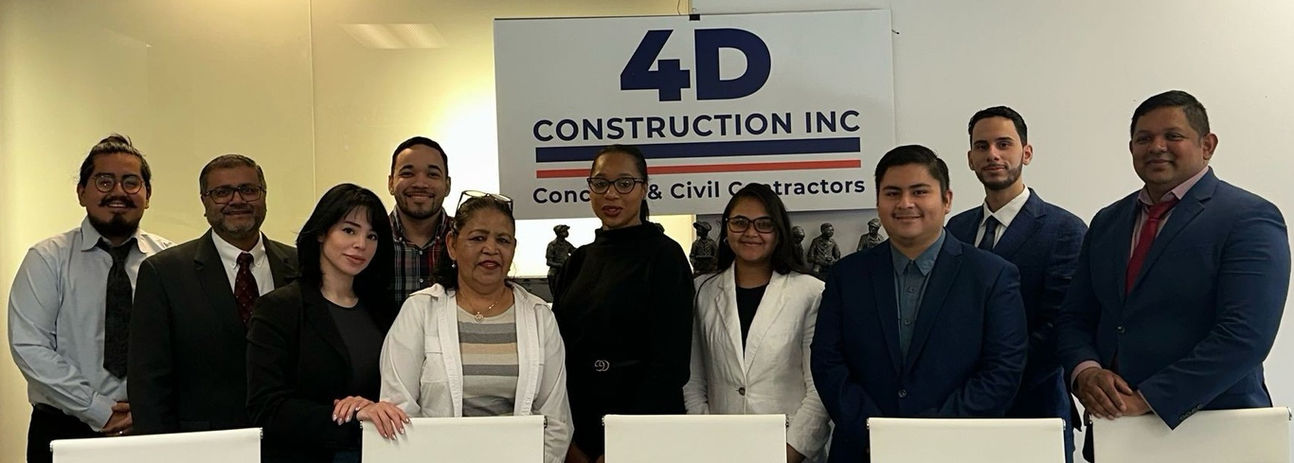 4D Construction Inc team standing together in an office.