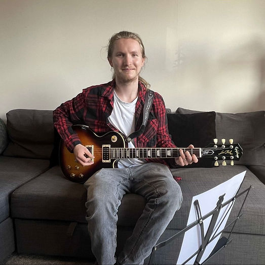 Tom teaching guitar