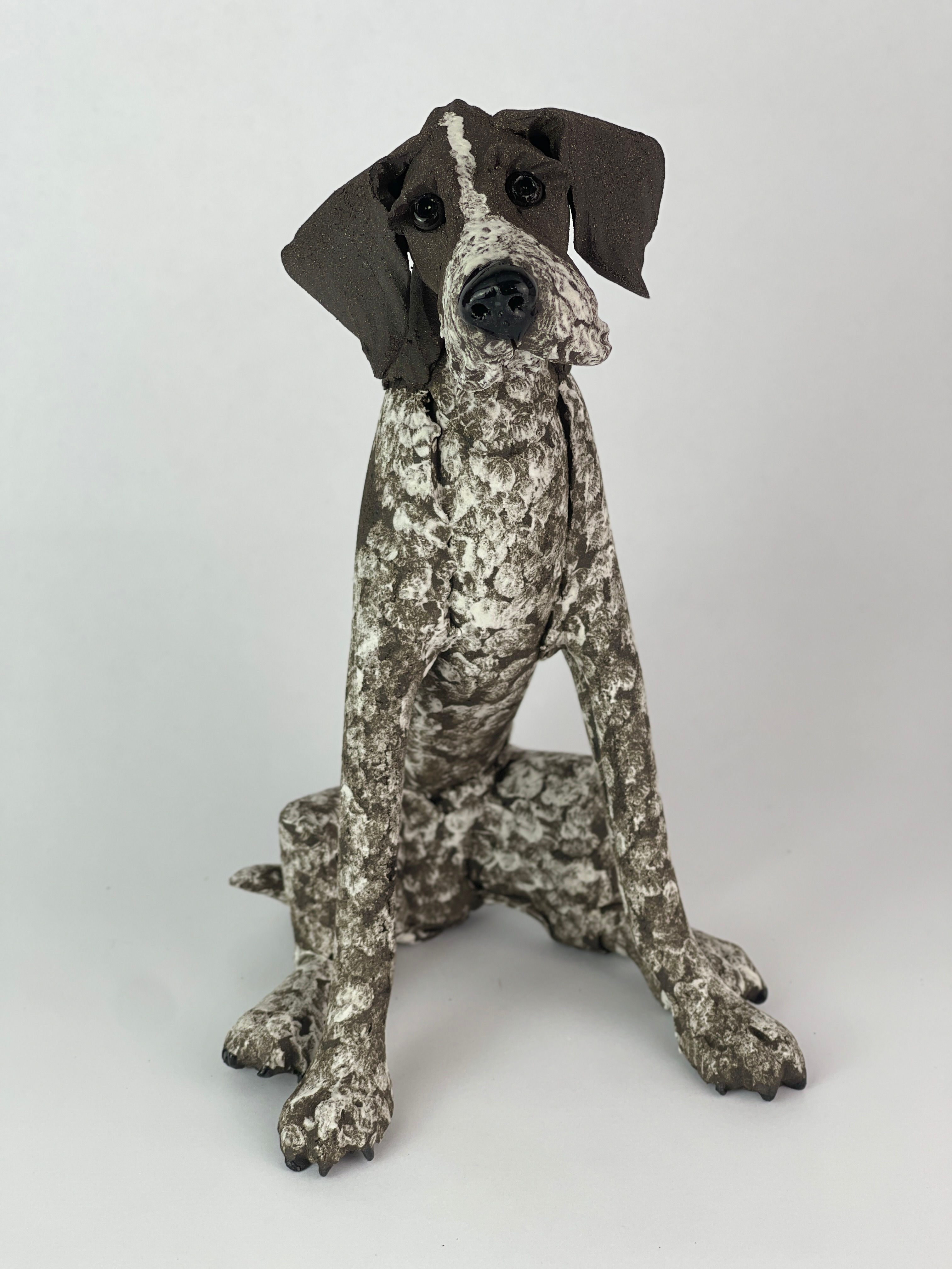 Wire haired German pointer ceramic sitting dog: Black & white