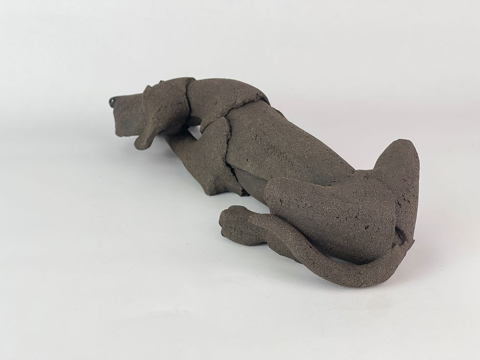 Thumbnail: Black ceramic laying dog