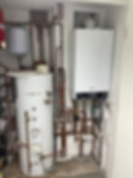 Boiler unit with pipes leading to cylinder
