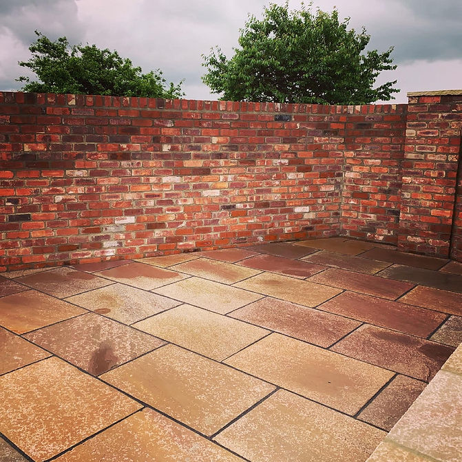 Newly installed patio and brick wall 