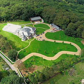 large mansion with immaculate lawns