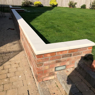 stone coping on a brick wall