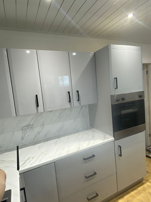White vinyl wrapped cupboards