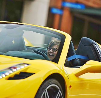 Rebecca drivng Ferrari