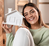 medium-shot-woman-holding-small-house.jpg