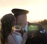 Newly wed couple posing for pictures on a bridge near Christie's of Genessee in Golden, Colorado