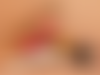 Two women practicing yoga; one assists the other in a side stretch. They're on a yoga mat against a peach background. Text: "Elements Yoga Academy."