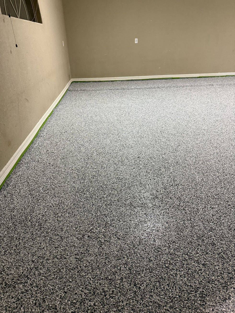Close-up of a full flake garage floor coating on Rodalyn Drive in Boerne