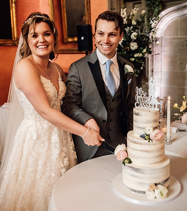 Semi naked wedding cake at Cowdray House, Midhurst, West Sussex
