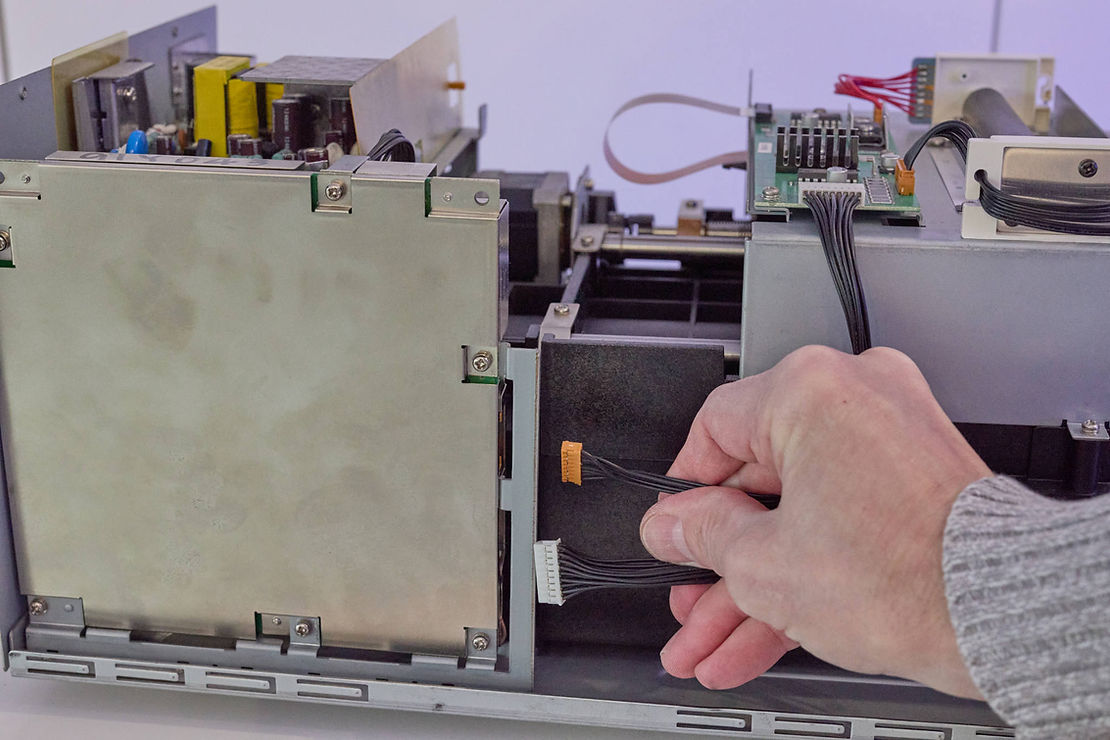 Two cable flat connectors are unplugged.