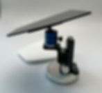 A small height-adjustable self-made device carries a machined acrylic glass plate on a ball head, which was attached with a glued-on flash unit holder, side view