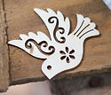 gray bird cutout decor on brown plank_ed
