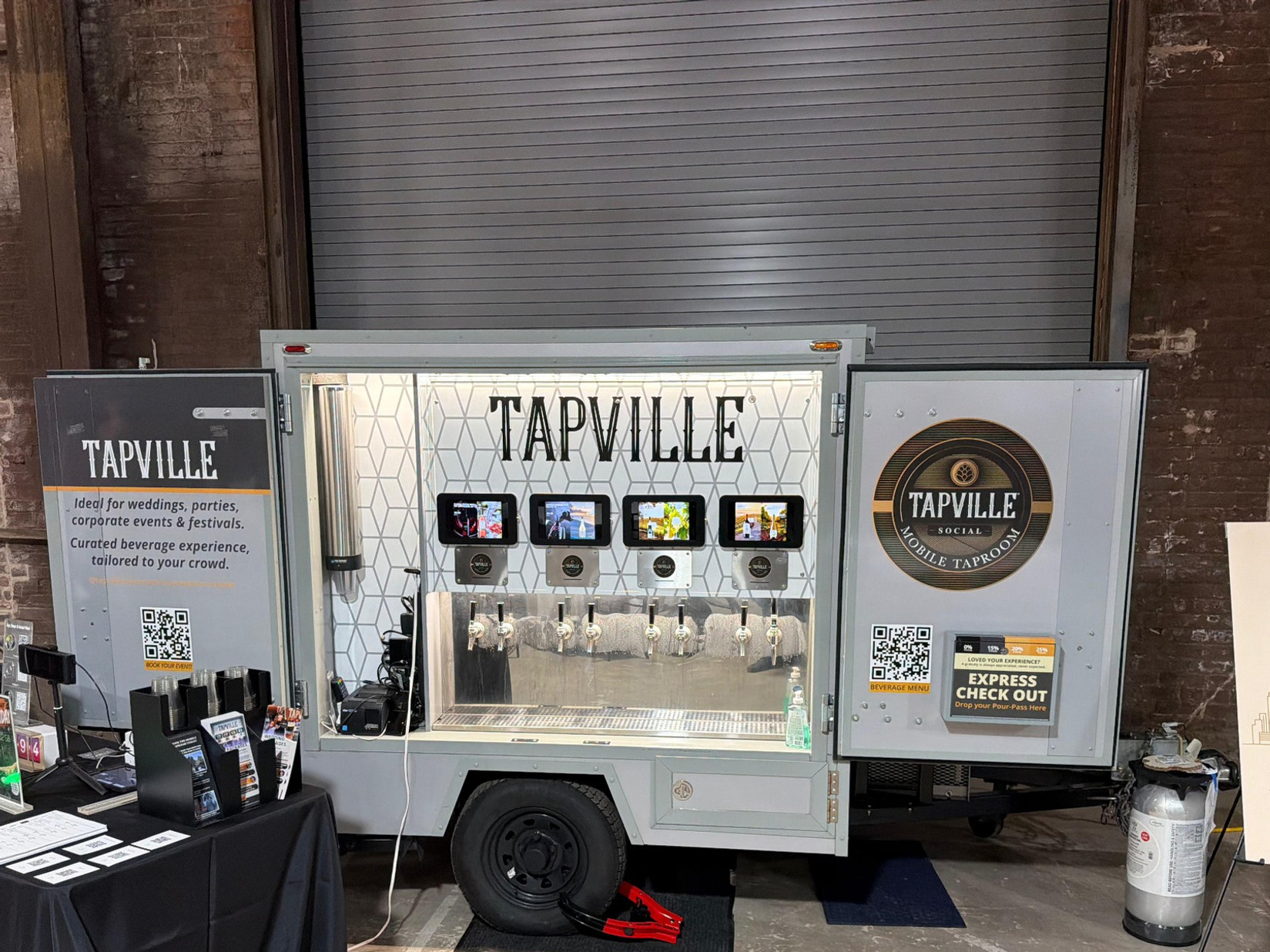 Taps Out ATL’s silver mobile taproom set up at the Gear Car Club event.