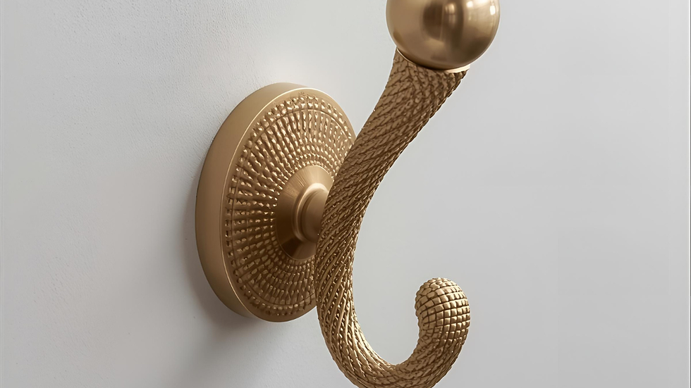 Close-up view of elegant brass wall hook mounted on a wooden wall