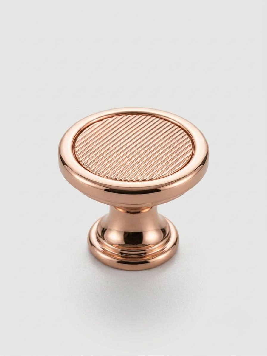 Thumbnail: Craftacks modern ribbed round cabinet knob with a polished rose gold finish displayed on a neutral background