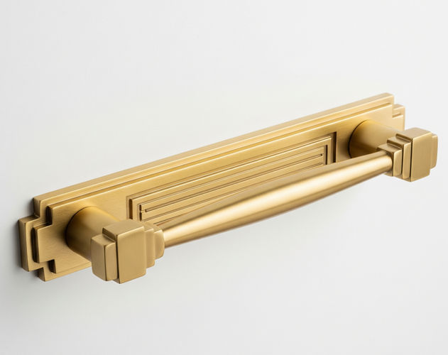 Title: Craftacks British Art Deco Entry Door Pull Handle - Aged Brass
Meta Description:
Elevate your home's entrance with our British Art Deco aged brass front door pull handle. Meticulously handcrafted by Craftacks, this statement piece combines classic elegance with modern durability.

Alt Text:
Aged brass front door pull handle with a British Art Deco stepped geometric pattern, mounted on a dark wooden door. The handle has a warm, vintage patina and reflects light, showcasing its intricate, symmetrical design.