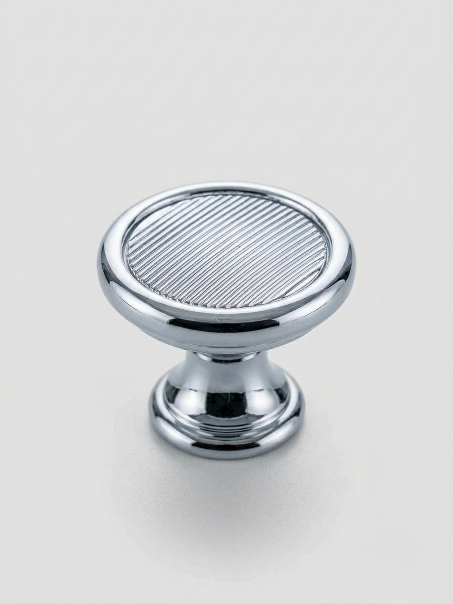 Thumbnail: Craftacks modern ribbed round cabinet knob with a polished chrome finish displayed on a neutral background
