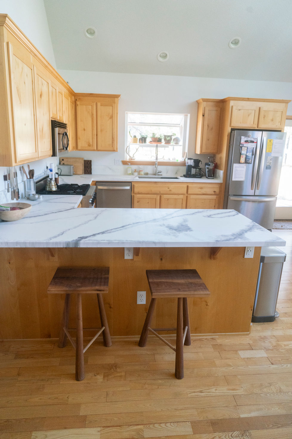 Fresh paint, epoxy counters and bar removal.