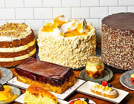 A diverse selection of delicious cakes and small desserts