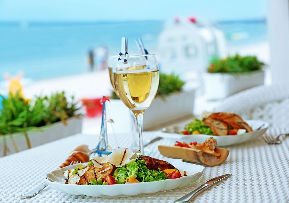 gourmet meal with wine on the beach
