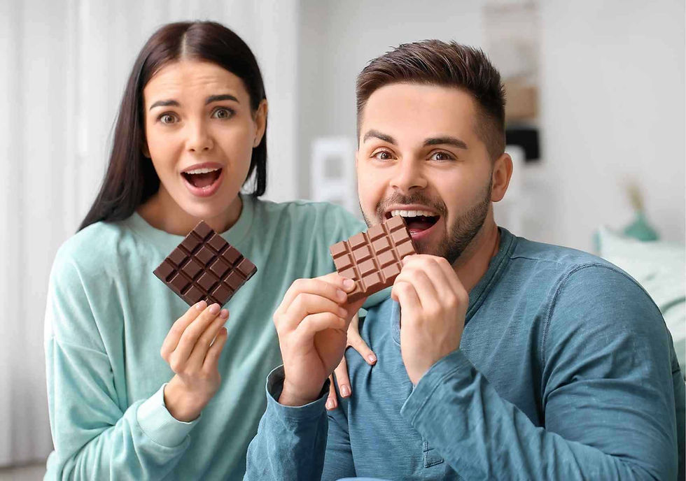 Happy Couple eating chocolate