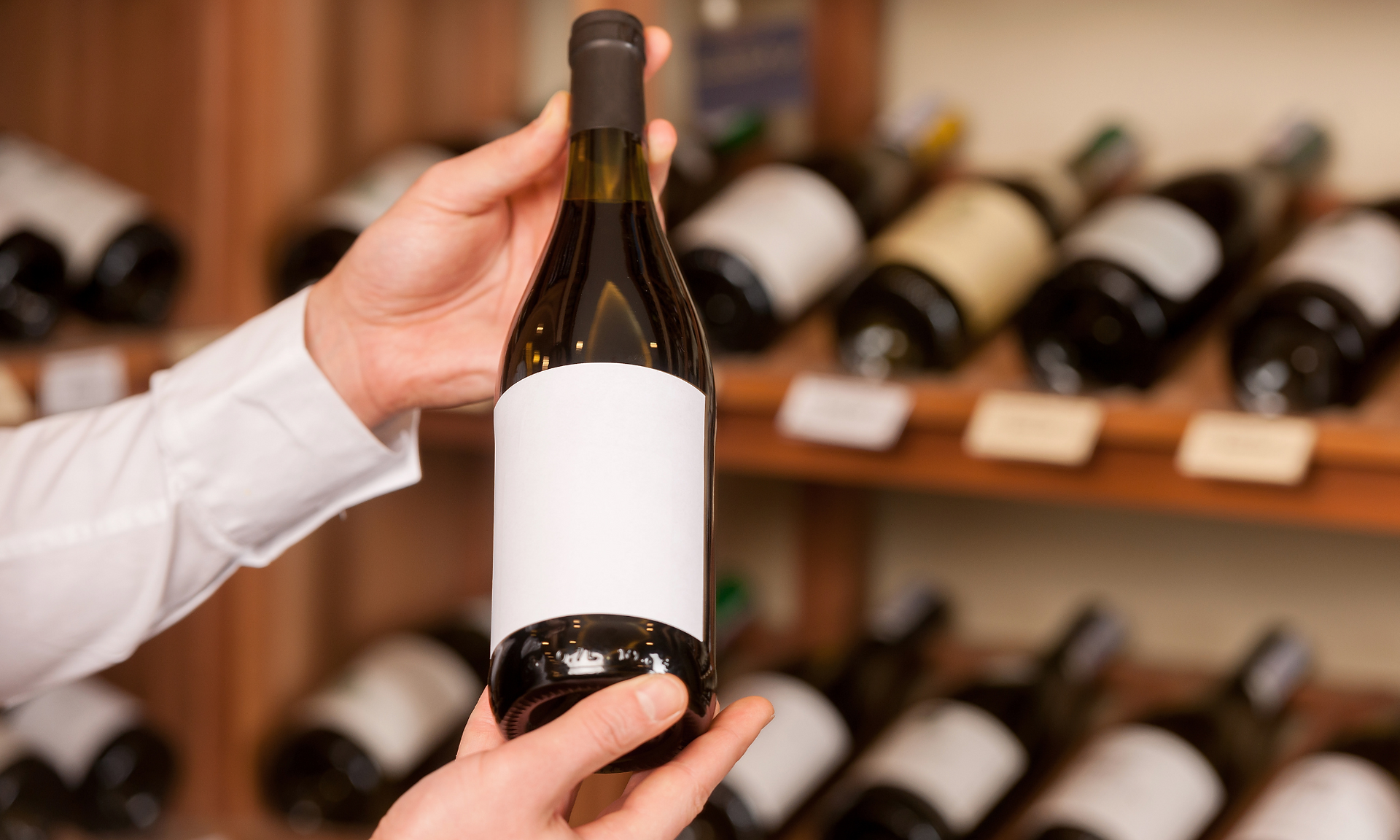 Waiter showing wine bottle