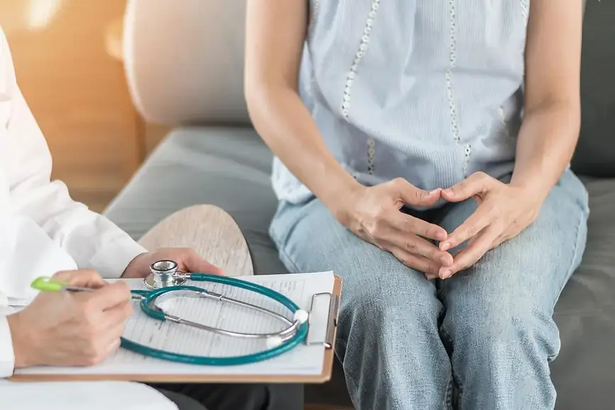 close-up-of-woman-s-hands-and-doctor-talking.webp