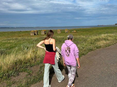 Two  women walking calmly in the countryside , ready for the day