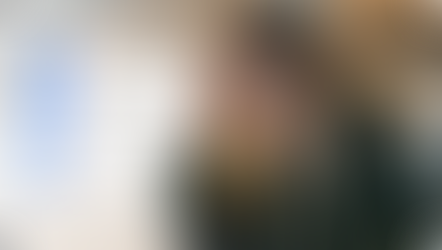 A freelancer at a laptop surrounded by notification icons from Slack, Gmail, Asana and ClickUp — overwhelmed by notification overload