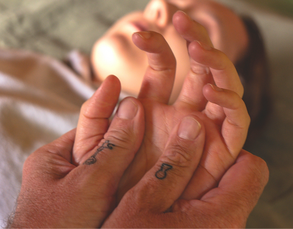 close up of hand being massaged