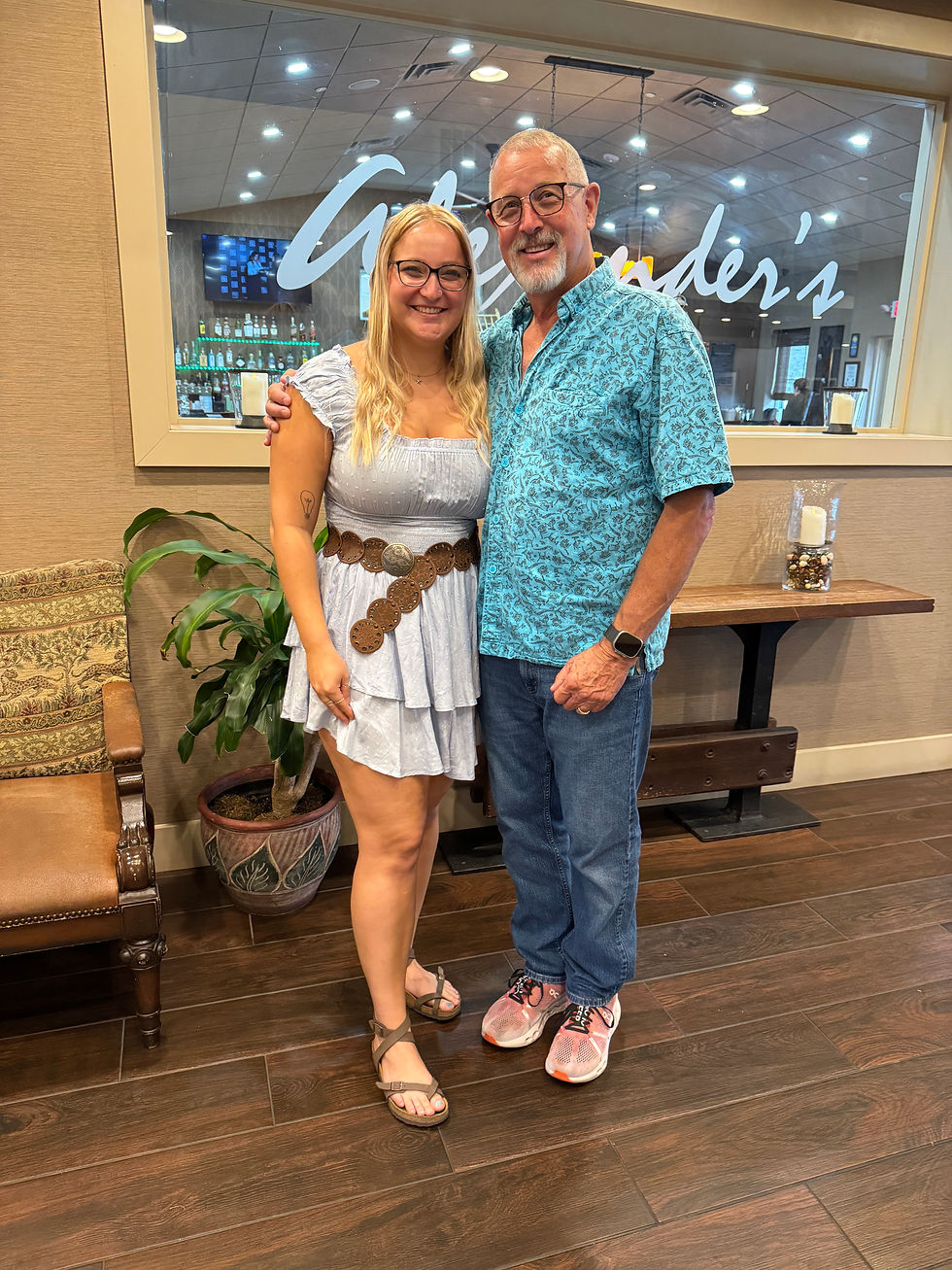 young blonde woman with her dad smiling