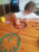 Students at table with Play Doh Clock