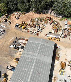 Aerial image of United Grading & Excavating’s equipment yard and operations center, showing construction vehicles, materials, and machinery organized for active job site deployment.