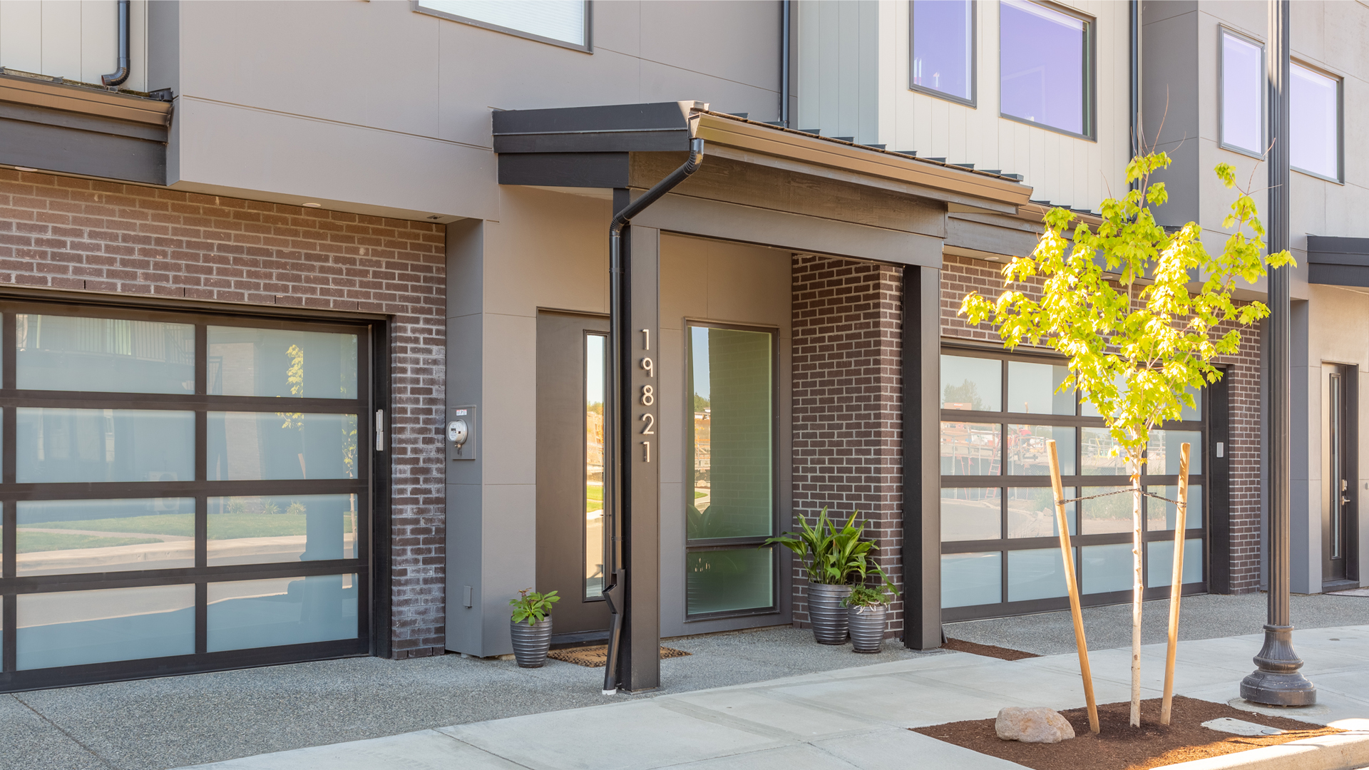 Covered front entryways with James Hardie Soffit Installation by StraightLine Exteriors for Boulder Ridge Townhomes at Columbia Palisades in Camas, Washington 98607