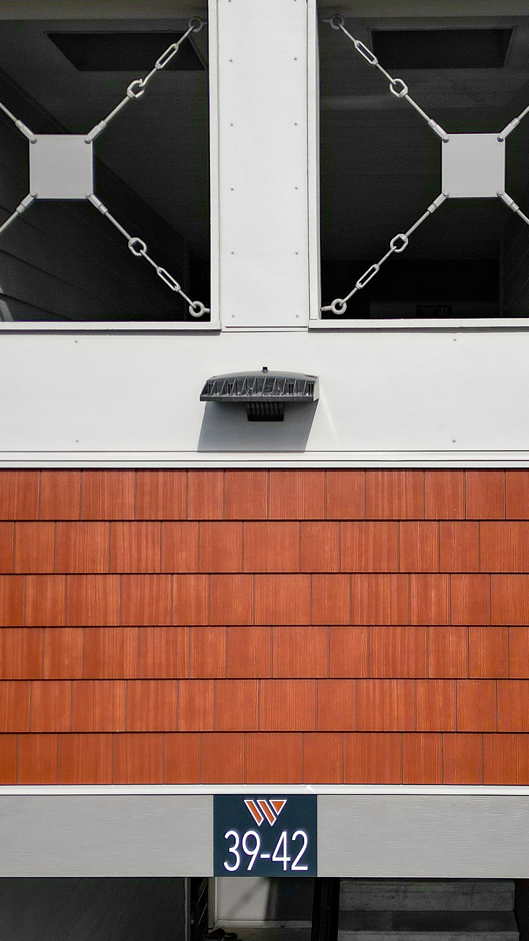 Product photo showing the color, texture and scale of Nichiha USA® Sierra Premium Shake in Maple. Photo taken at Wingate Square Apartments after commercial siding, soffit & window installation by StraightLine Exteriors in Vancouver, Washington 98662.