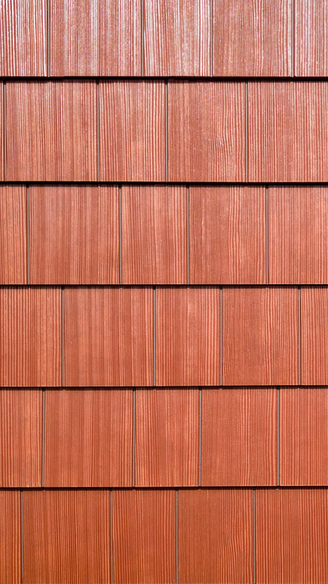 Close-up product photo showing the color, texture and scale of Nichiha USA® Sierra Premium Shake in Maple. Photo taken at Wingate Square Apartments after commercial siding, soffit & window installation by StraightLine Exteriors in Vancouver, Washington 98662.