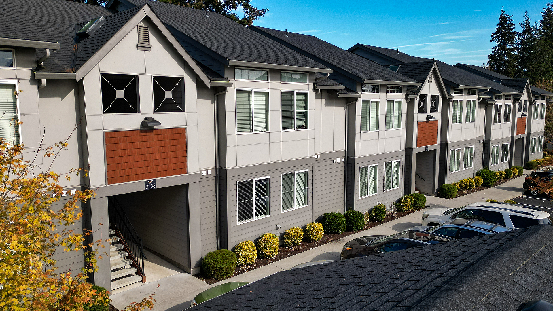 Mid-day aerial photo showing the contemporary exterior design of Wingate Square Apartments after commercial siding, soffit & window installation by StraightLine Exteriors in Vancouver, Washington 98662.