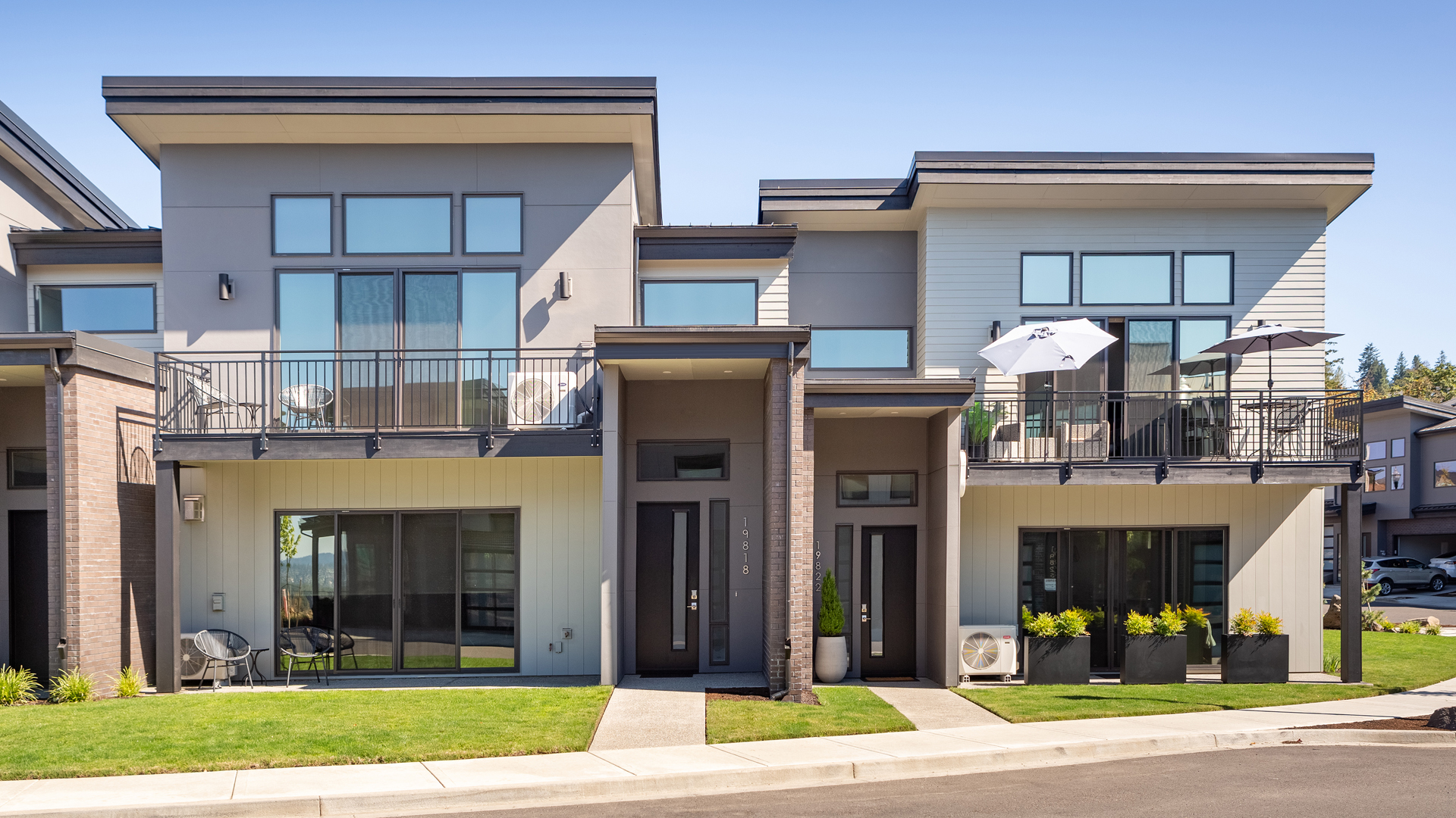 Indoor / Outdoor Living Spaces with Commercial Siding Installation by StraightLine Exteriors for Boulder Ridge Townhomes at Columbia Palisades in Camas, Washington 98607