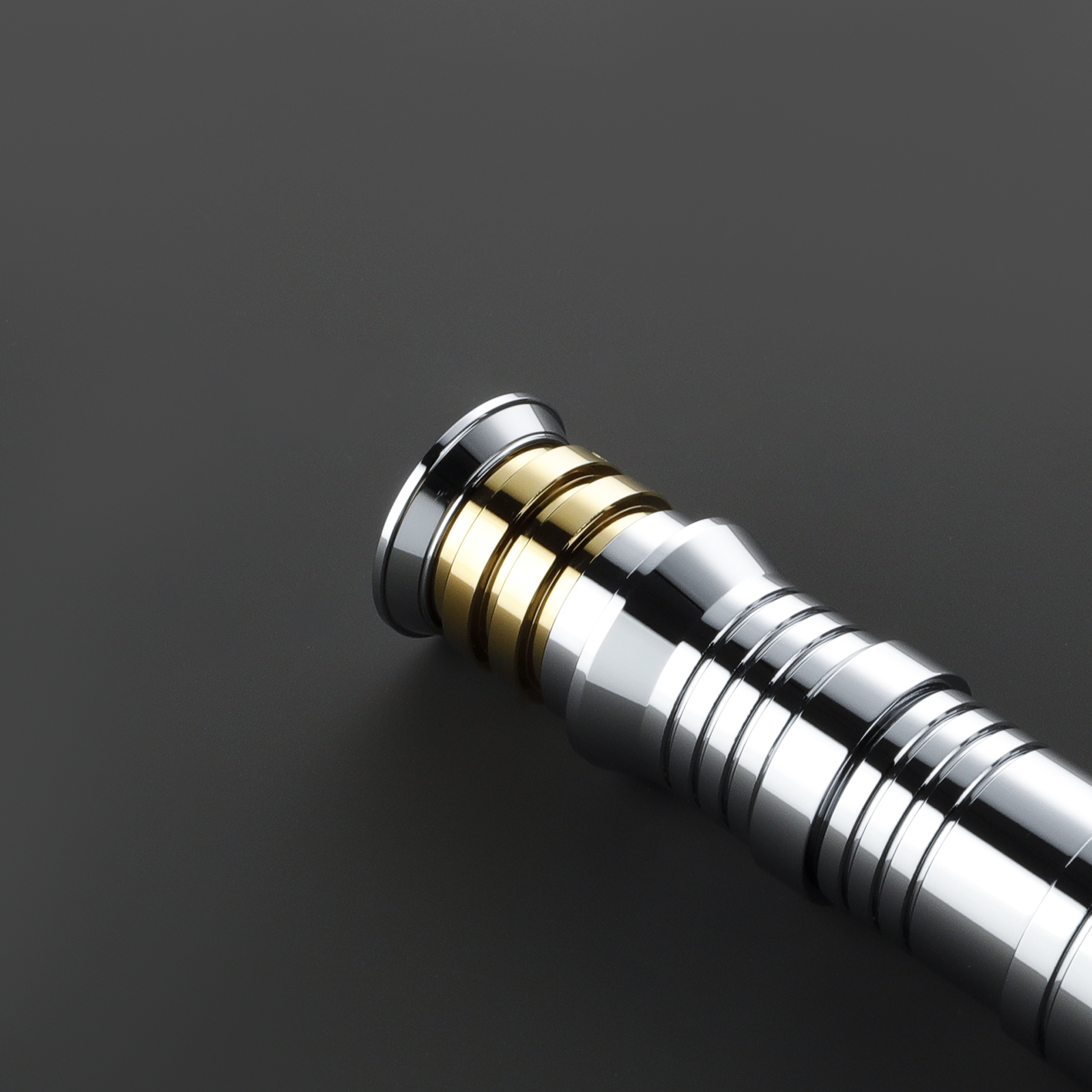 Close-up of replica lightsaber hilt components and precision detail