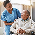 nurse-and-patient-in-wheelchair-smiling.jpg