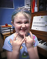 piano student during her lesson